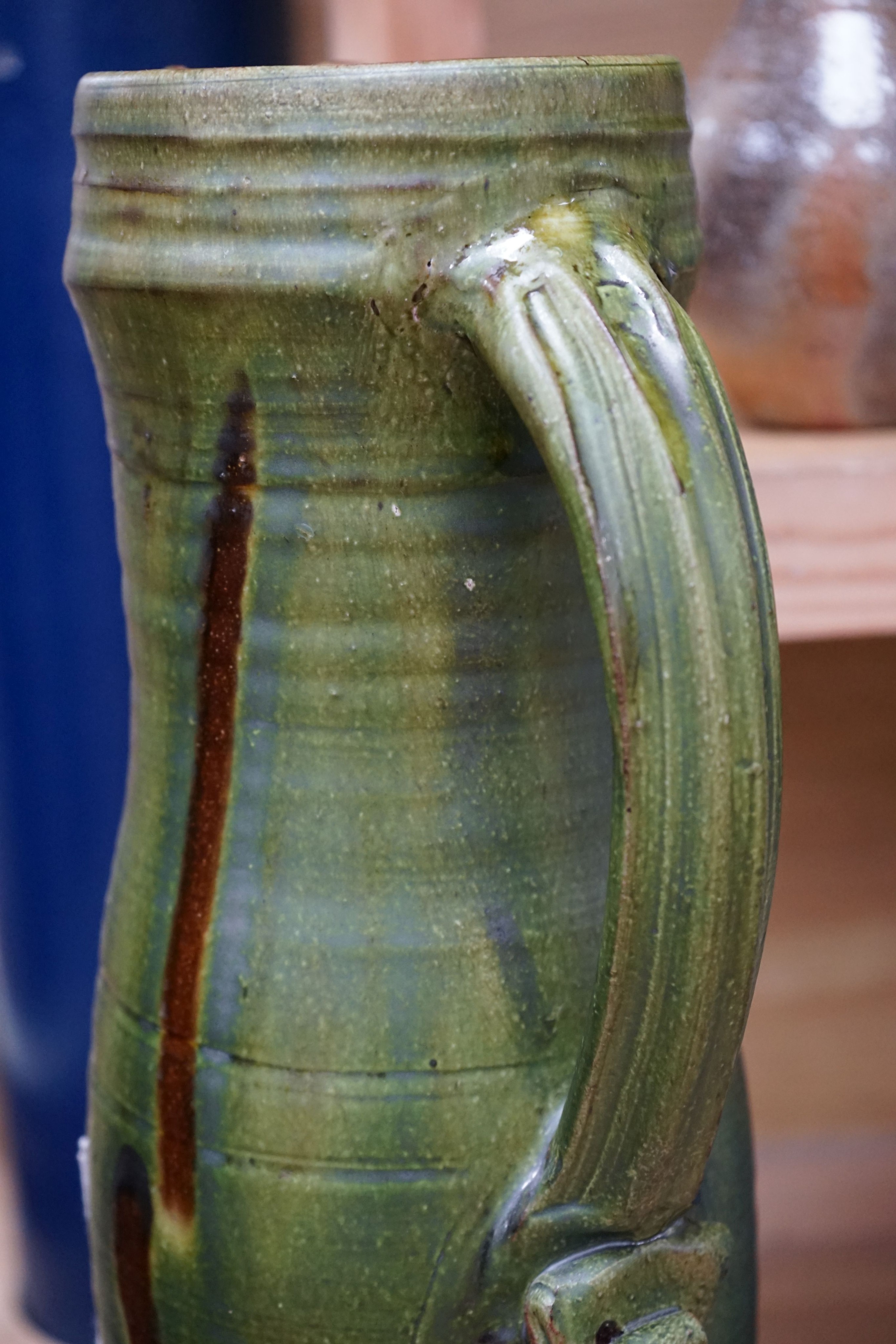 Clive Bowen (b.1943), a tall green glazed and brown slip decorated ewer, 59cm